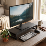 Apex monitor riser on a tidy home-office desk with keyboard tucked underneath